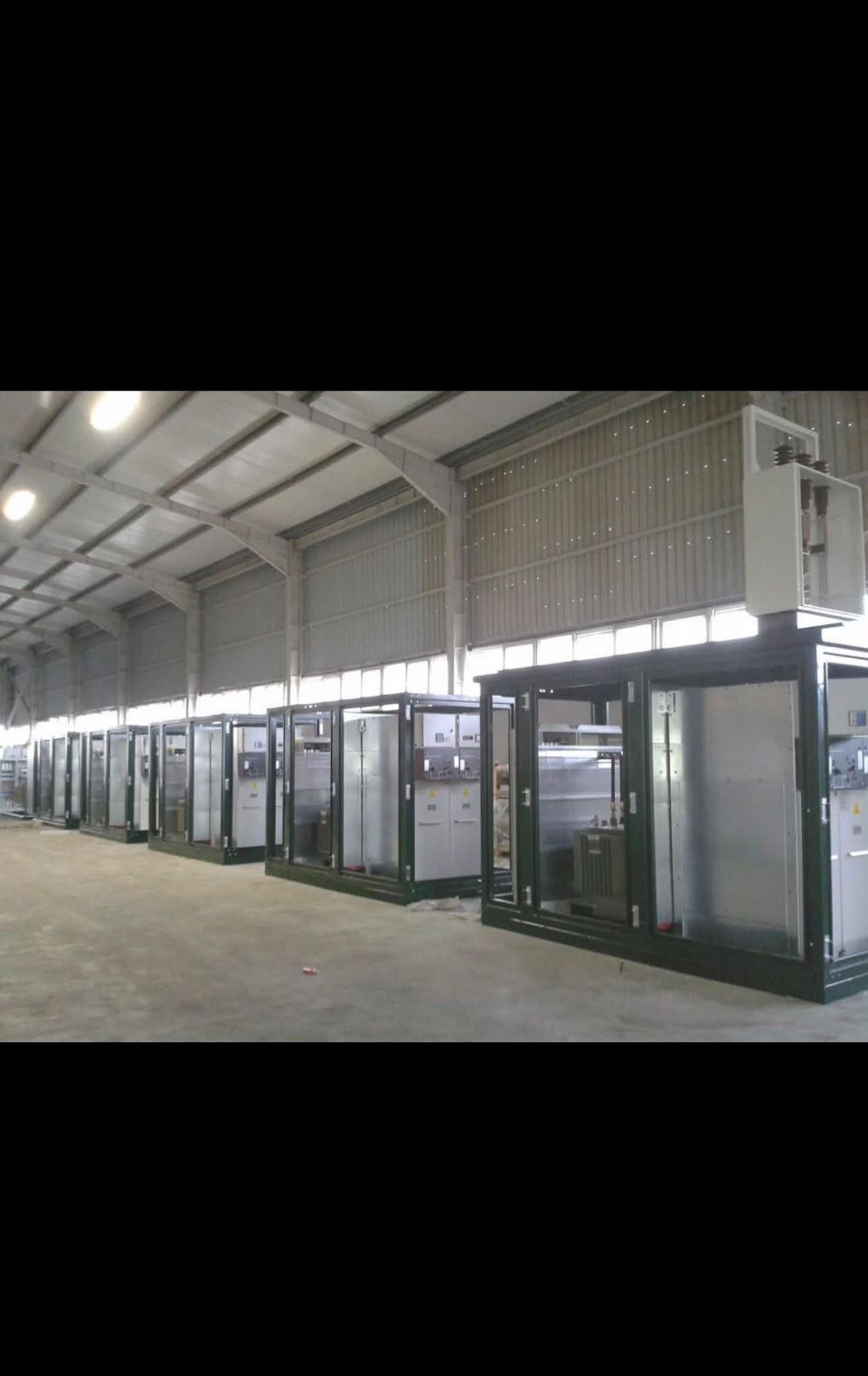 Row of equipment containers inside the factory
